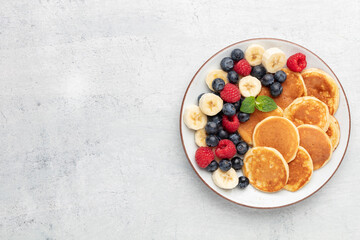 Wall Mural - Keto diet pancakes made or almond flour, served with berries.