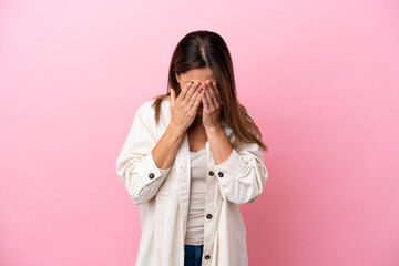 Wall Mural - Middle age caucasian woman isolated on pink background with tired and sick expression