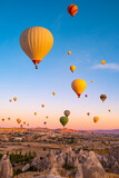 Hot air balloons flying on sunset sky in Cappadocia, Turkey