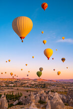 Hot Air Balloons Flying On Sunset Sky In Cappadocia, Turkey