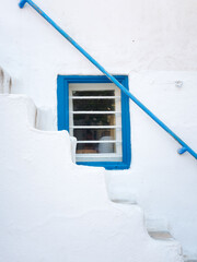 Wall Mural - Mykonos, Greece. Design in detail on the streets of Mykonos. Narrow streets and traditional architecture. Photo as wallpaper.