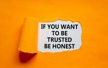 Be Trusted And Honest Symbol. Concept Words If You Want To Be Trusted Be Honest On White Paper On A Beautiful Orange Background. Business And Be Trusted And Honest Concept. Copy Space.