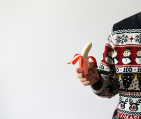 Wall Mural - person holding fresh raw red banana, healthy eating