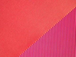 Background surface made of red, crimson pape rwith diagonal stripes