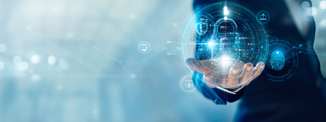 Poster - Cyber security and data protection. Businessman holding padlock protecting business data with virtual network connection. Innovation technology develop smart solution from digital attack.