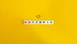 Hot Topic Banner, Icon, and Phrase. Block Letter Tiles on Orange Yellow Background. Minimal Aesthetics.