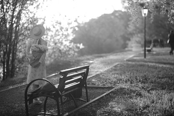 Wall Mural - vintage photo of a girl / sepia, black and white portrait of a beautiful young woman, happiness summ