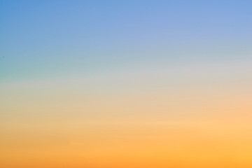 Wall Mural - Sunset red and blue gradient sky, copy space for text. Orange-blue sky gradient, clear sky without clouds