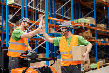 Wall Mural - Two post express workers giving high five for efficiency and dedication.