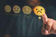 Customer unhappy service and Satisfaction concept ,Client touching virtual screen on Smiley face icon to give satisfaction in service. 1-star rating very dissatisfied