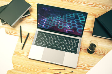 Poster - Creative concept of wireless technology with hexagon hologram on modern laptop screen. Big data and database concept. 3D Rendering