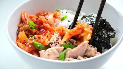 Canvas Print - Kimchi tuna rice salad in white bowl. Traditional Korean food.