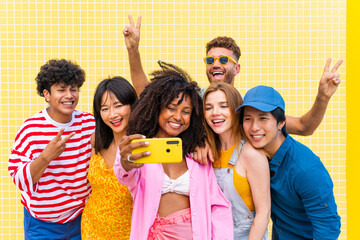 Group of young best friends bonding outdoors - Multiracial people bonding and having fun at the beach during summer vacation