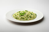 Fototapeta Mapy - Risotto with green asparagus and parsley in white plate