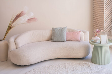 Wall Mural - Beige sofa against white wall, empty copy space in simple and modern living room interior