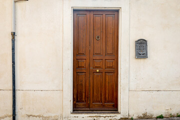 Wall Mural - Brown door with golden knocker