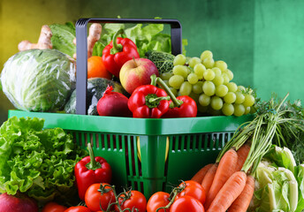 Wall Mural - Fresh organic fruits and vegetables in plastic shopping basket