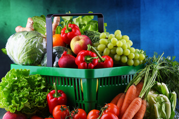 Wall Mural - Fresh organic fruits and vegetables in plastic shopping basket