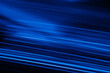Blur neon glow. Luminous light flare. Cyber glare reflection. Defocused UV navy blue color streak rays motion on dark night black futuristic abstract background.