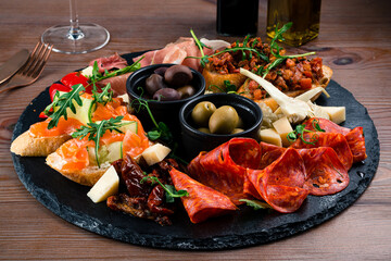 Wall Mural - Antipasto board with prosciutto, salami, cheese, olives