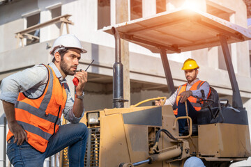 Poster - Foreman talking on walkie-talkie and working at construction site.