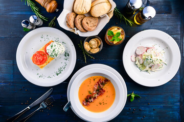 Poster - Top view of a three course set menu served on wooden table