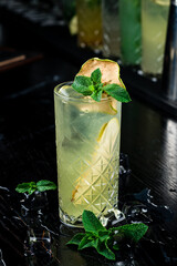 Canvas Print - Green cocktail with ice and mint. Apple mojito with mint and ice