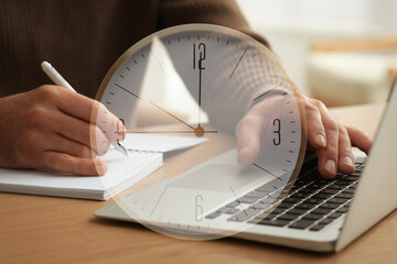 Double exposure of man working with laptop and clock