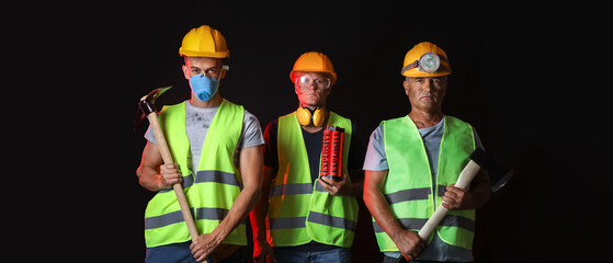 Wall Mural - Miner men on black background