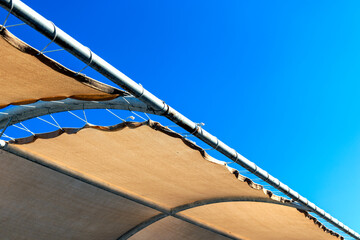 Wall Mural - sun-blocking tent cover on the beach.