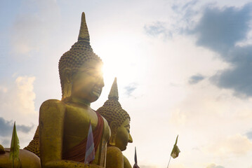 Wall Mural - Big golden buddhas nighttime on the mountains