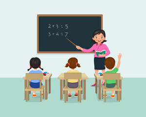 Wall Mural - Young female teacher teaching math lesson to students in the classroom 