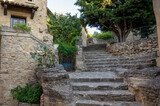 Fototapeta Na drzwi - VIew on medieval buildings in sunny day, vacation destination wine making village Chateauneuf-du-pape in Provence, France