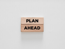 The Words Plan Ahead On Wooden Blocks On White Background.