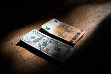 Canvas Print - euro and dollar money on two different corners