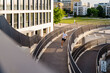 © Westend61 - Young man running on elevated walkway
