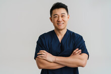 Adult Asian Man Wearing Medical Uniform Posing At Camera
