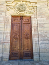 Large Wooden Door With Ornaments Framed With Sandstone. Entrance Gate To The Cathedral In Sankt Blasien. Black Forest, Germany. July 07, 2022