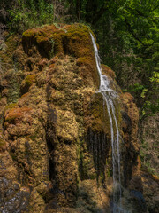Wall Mural - Scenic landscape view of waterfall on rock covered with moss in the Boulzane river valley, Pyrenees mountains near Gincla, Aude, France