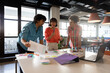 © WavebreakMediaMicro - Multiracial young design professionals planning strategy in meeting at office