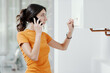 © StockPhotoPro - Woman calling a boiler breakdown service