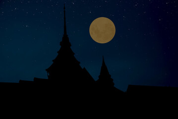 Wall Mural - full moon with temple silhouette in the dark night.