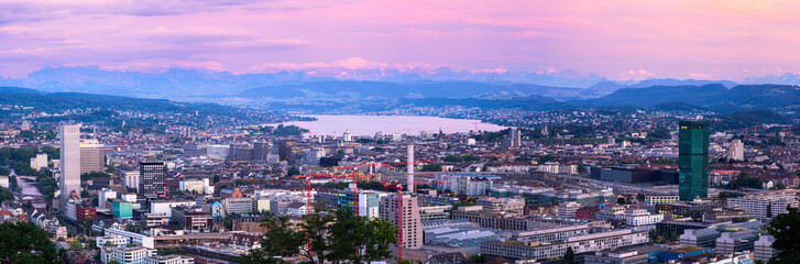 Zurich, Switzerland - July 7, 2022: Cityscape evening panorama of Zurich, the largest city in Switzerland. It is located in north-central Switzerland at the northwestern tip of Lake Zurich.