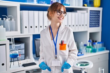 Sticker - Young woman scientist smiling confident standing at laboratory