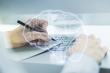 Poster - Double exposure of creative human brain microcircuit with hand writing in notepad on background with laptop. Future technology and AI concept