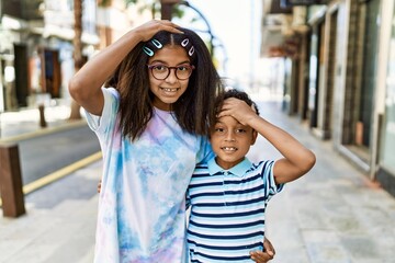 Sticker - African american family of bother and sister standing at the street stressed and frustrated with hand on head, surprised and angry face