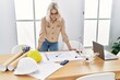 © Krakenimages.com - Young caucasian woman working at architect studio