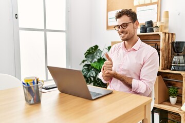 Canvas Print - Young hispanic man having video call communicating with deaf sign language at office