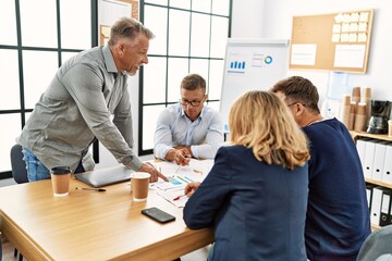 Wall Mural - Group of middle age business workers working at the office.