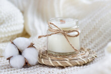 Soy Wax Candle With Cotton Flower On White Cozy Blanket